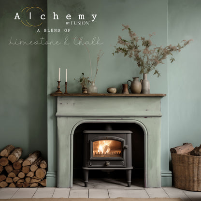 Chimenea vintage restaurada con Alchemy by Fusion Thyme en verde azulado suave con pared a juego, ambiente acogedor con estufa de leña, jarrones cerámicos y ramas secas, pintura limestone y chalk